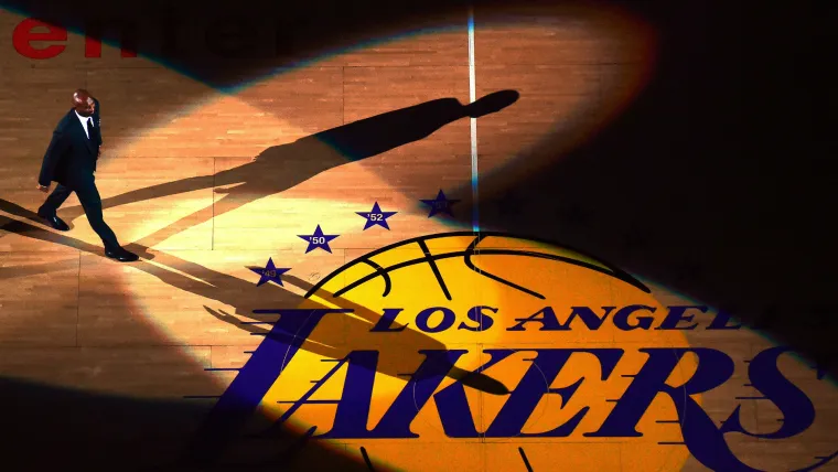 Kobe Bryant walks onto the STAPLES Center court during his jersey retirement ceremony.