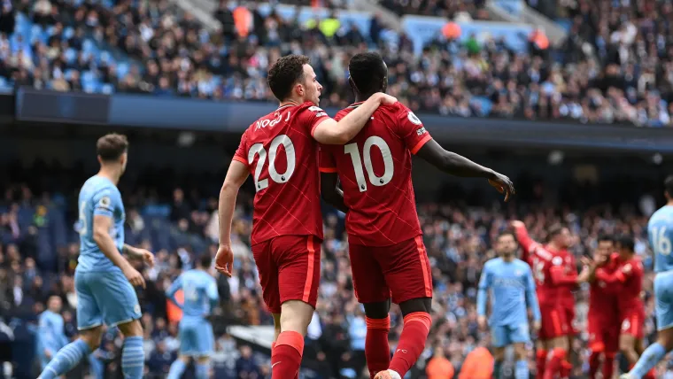 Diogo Jota celebrates with Sadio Mane at the Etihad Stadium