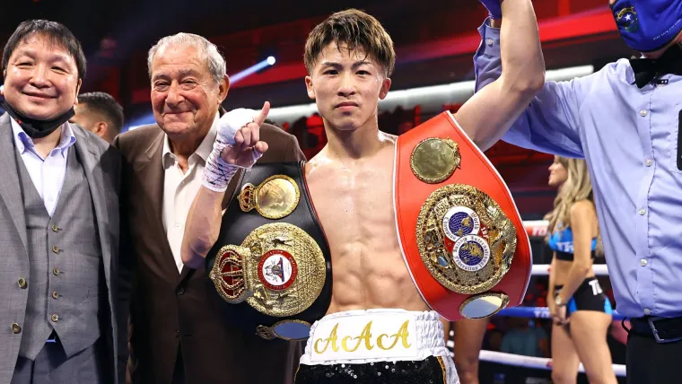 Naoya Inoue with WBA and IBF belts