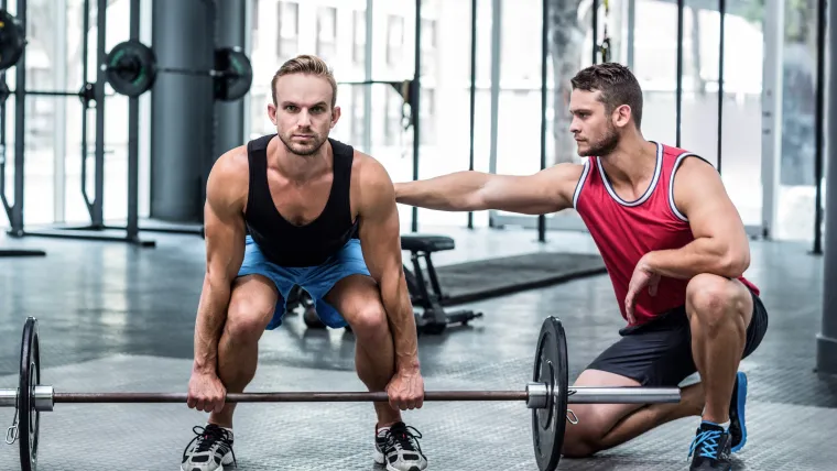 Spotting at the gym, Shutterstock