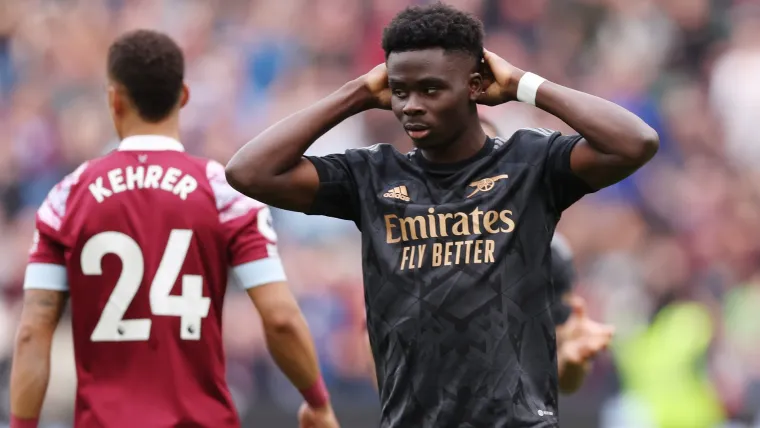 Bukayo Saka reacts after missing a penalty for Arsenal