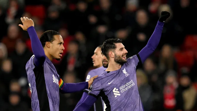 Virgil van Dijk and Dominic Szoboszlai of Liverpool