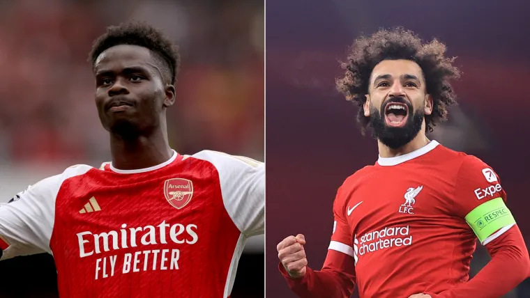 Bukayo Saka of Arsenal and Mohamed Salah of Liverpool split