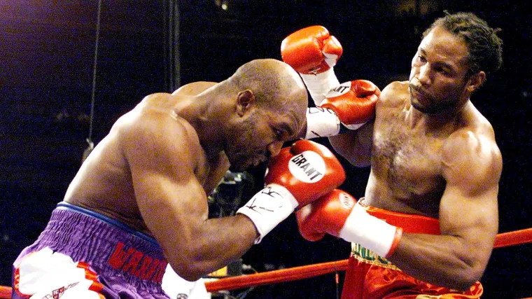 Lennox Lewis chazing down Evander Holyfield